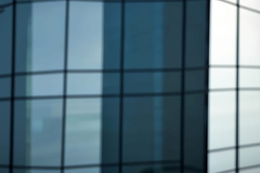 blurred abstract grey glass wall from building background. abstract architectural theme