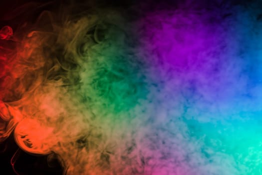 colorful smoke on dark background. artistic colorful background