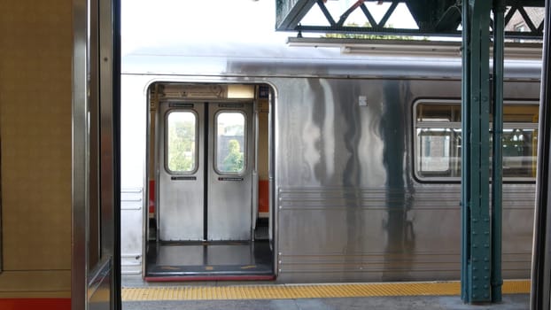 New York City, United States - 2 Sept 2023: Subway train, inside metropolitan wagon. Metro transport, NYC passenger transportation, public underground railway. Railroad traffic. Empty station platform