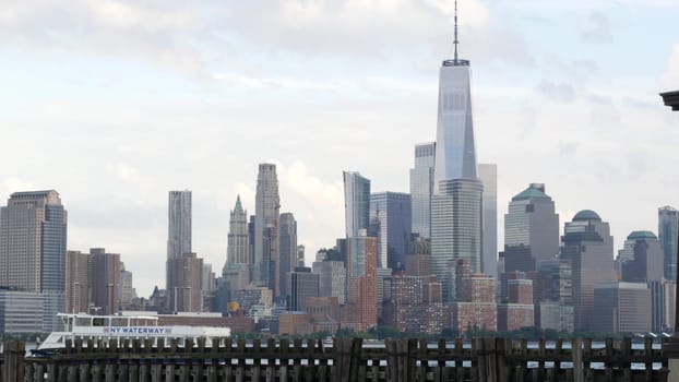 New York City, United States - 11 September 2023: Waterfront skyline, Manhattan Downtown, World Trade Center building. Riverfront skyscrapers from Pier A, Hoboken, New Jersey. Hudson river ferry boat.