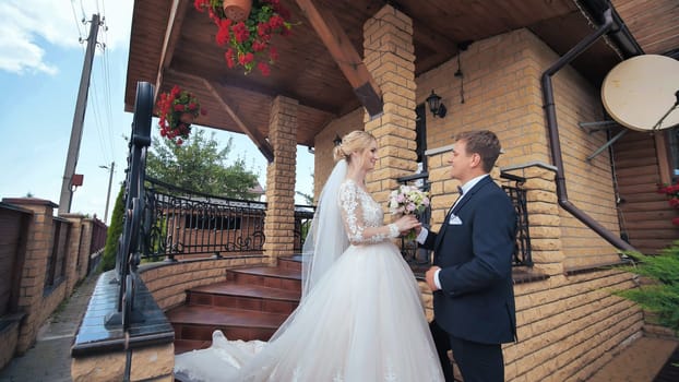 The groom meets his bride and gives her a bouquet