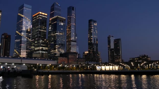New York City, United States - 4 Sept 2023: Manhattan Midtown skyline from river ferry boat. Hudson Yards skyscrapers from ferryboat. Waterfront panorama, riverfront buildings architecture.