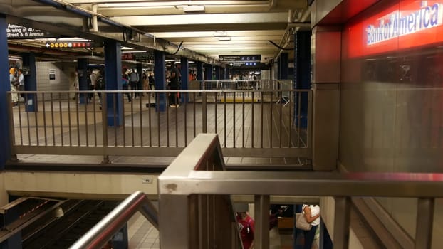 New York City, United States - 31 Aug 2023: Manhattan subway station interior, underground metropolitan transfer. Public metro transport. Railway change hub, passenger traffic. People, Bank of America
