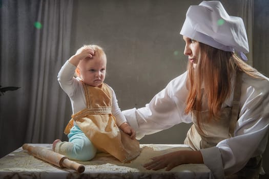A mother and daughter joyfully engage in a flour-filled moment, creating memories in a cozy kitchen setting.