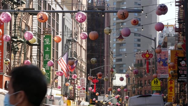 New York City, United States - 14 Sept 2023: Manhattan Chinatown Mott street, chinese ethnic district buildings architecture, USA. Red round paper lanterns, people and hieroglyph signs. Little China.
