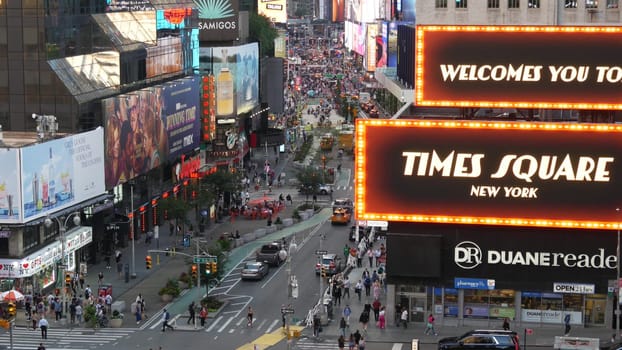 New York City, United States - 14 Sept 2023: Times Square, Manhattan Midtown Broadway street, USA. American NYC urban road traffic, people crowd from above. Commercial illuminated billboard screens.
