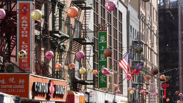 New York City, United States - 14 Sept 2023: Manhattan Chinatown Mott street, chinese ethnic district buildings architecture, USA. Red round paper lanterns, people and hieroglyph signs. Little China.