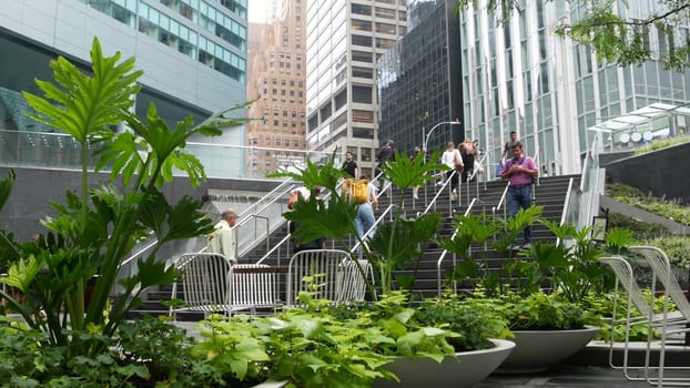 New York City, United States - 11 Sept 2023: Manhattan Midtown office buildings, Lexington avenue, United States. People pedestrian exiting subway metro station, stairs on 53 street, USA urban life.