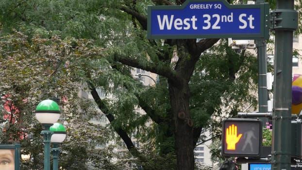 New York City, United States - 29 Aug 2023: Manhattan Broadway street intersection road sign. Midtown district, Greeley, Herald Square. Subway globe, metro entrance orb lamp, traffic light, roadsign.