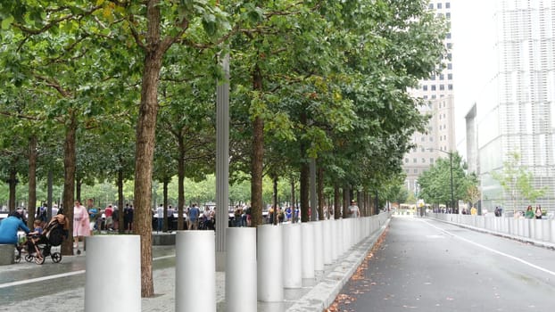 New York City, United States - 10 Sept 2023: Manhattan Downtown Financial District. People near World Trade Center Oculus. Memorial pools and 911 Museum area, Fulton street architecture in USA. Trees.