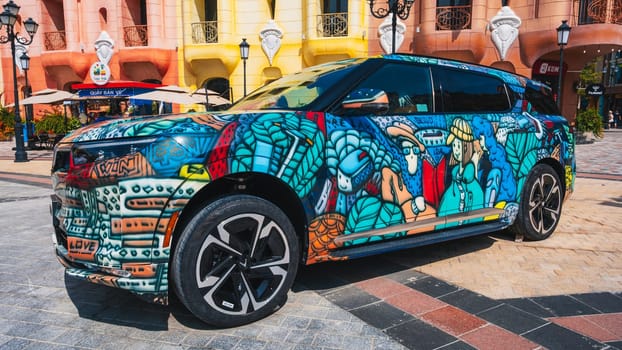 Vietnamese Vinfast VF9 electric car painted with airbrushing and graffiti is presented on Vinpearl Island in Nha Trang. Nha Trang, Vietnam - March 6, 2025