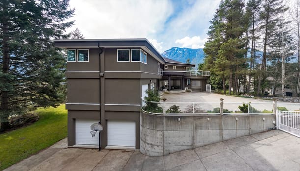 Luxury residential house on mountain background.