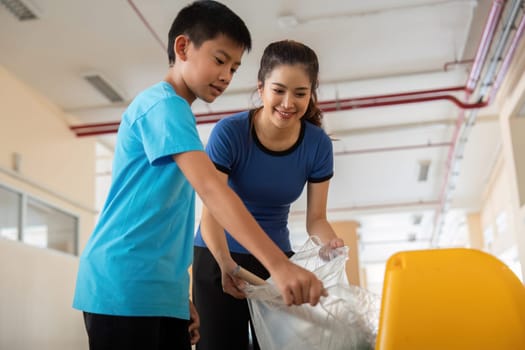 A child and an adult engage in eco-friendly practices by managing waste properly, fostering teamwork and responsibility towards the planet.