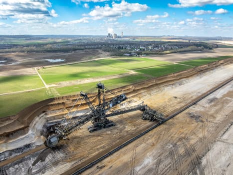 NIEDERZIER, GERMANY - MARCH 29, 2025: Aerial view of the Hambach open-pit coal mine. in Niederzier and Elsdorf, North Rhine-Westphalia. It is operated by RWE and used for mining lignite. 