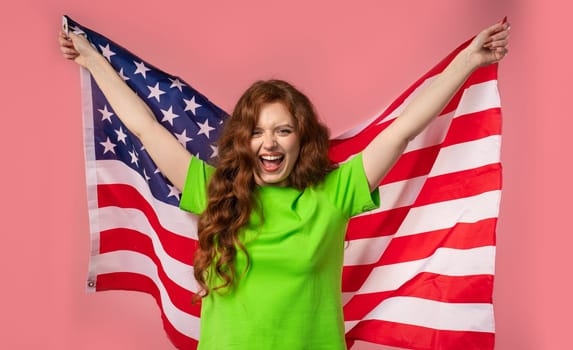 Smiling woman with national USA flag on pink background. American patriot, 4th of July - Independence day celebration, election, America, labor. US banner. High quality