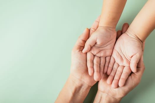 Parents and kid hold empty hands top view isolated. Illustrating Family Day togetherness support and the legacy passed down.