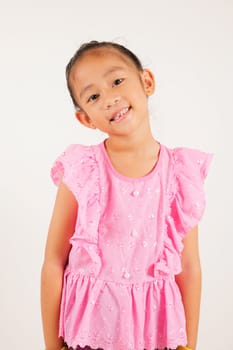 Portrait of Thailand kid girl smiling traditional Thai dress costume in studio shot isolated white background, Happy Portrait kindergarten little woman stand and looking to camera