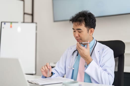 A healthcare professional conducts a virtual consultation, taking notes and providing guidance remotely, showcasing the convenience of telehealth services.