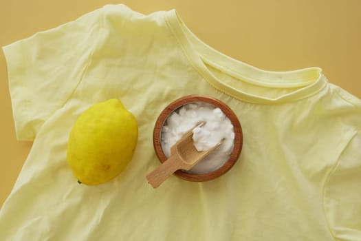 baking soda and lemon on yellow shirt ,