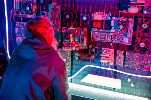 Asian woman wearing a black jacket hacking programming system check hacking hardware circuit in dark office, Cyber security agency developing, Computer electronics and technique