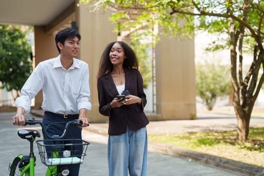 A vibrant conversation unfolds between two young adults, emphasizing the importance of sustainable transportation in their daily lives.