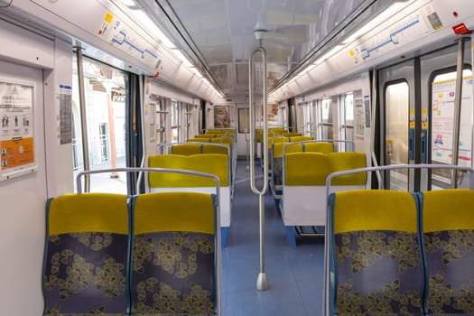 PARIS, FRANCE - February 23, 2025: View inside Paris Metro wagon of RER line, empty seats for passengers of transport system