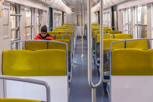 PARIS, FRANCE - February 23, 2025: View inside Paris Metro wagon of RER line, empty seats for passengers of transport system