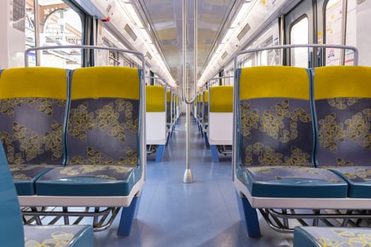 PARIS, FRANCE - February 23, 2025: View inside Paris Metro wagon of RER line, empty seats for passengers of transport system
