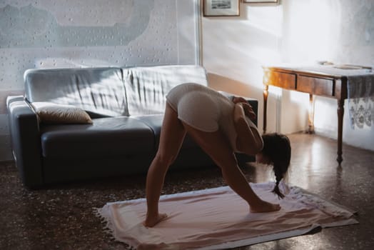 A serene yoga practice captured in the soft glow of morning light, promoting tranquility and mindfulness.