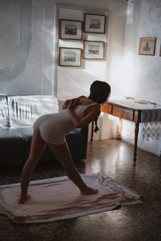 A tranquil and serene moment of yoga practice focusing on flexibility in a beautifully artistic setting
