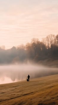 A peaceful morning scene with a person fishing by a misty lake, surrounded by autumn trees.