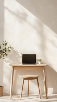 A minimalist workspace with a laptop, wooden desk, and natural light casting shadows on the wall.
