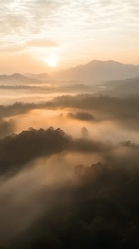 A breathtaking misty sunrise unfolds over a lush, mountainous landscape, creating a serene morning scene.