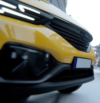 A yellow crossover vehicle drives on a snowy street, showcasing its front grill and headlights.
