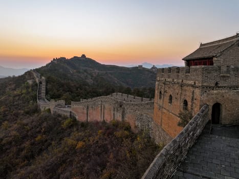 Real, non-AI photograph of the Jinshanling section of the Great Wall of China shortly after sunset, near Beijing, China.