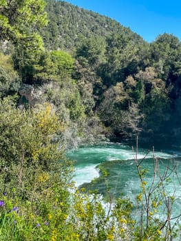Green Krka River, Croatia. Peace and relaxation in a natural environment. Exotic travel and tourism. Background for tourism brouchures.Format used in IG stories background