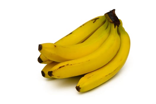 A cluster of ripe yellow bananas rests on a pristine white surface, their curved shapes and glossy skin reflecting a sense of freshness and natural allure, ideal for a nutritious boost.
