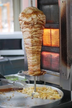 Freshly roasted shawarma spins on the grill, ready for serving.