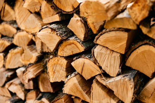 stack of firewood at a rustic store in the uk, ready for cozy winter nights by the fireplace