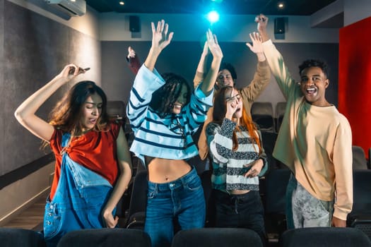 Friends are dancing and enjoying music at a movie disco event, celebrating togetherness and the joy of cinema