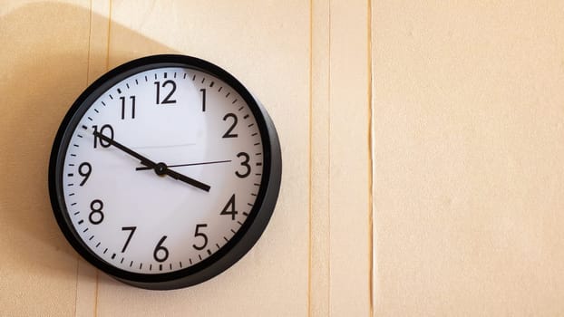 A beautifully designed clock that is gracefully hanging on a wall shows the precise time as 420 in clear digits