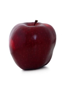 This succulent red apple stands alone, radiating freshness with its polished skin and curvaceous shape. Its rich hue and shine highlight its natural appeal, evoking thoughts of orchard harvests.