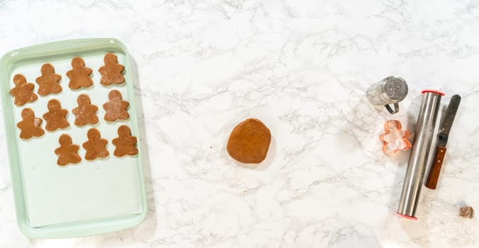 A smooth ball of gingerbread dough resting on a marble surface, ready to be rolled and cut with a gingerbread girl cookie cutter for Orange Zest Gingerbread Cookies.