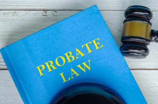 Top view of Probate Law book with gavel background.