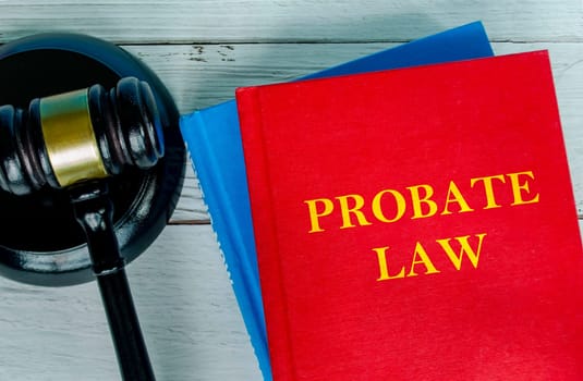 Top view of Probate Law book with gavel background.