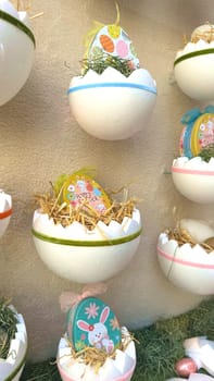 28.03.2025 Innsbruck: Decorative Easter Eggs Displayed in Festive and Creative Containers for Celebration. Colorful Easter eggs artistically displayed in unique containers with festive decorations, hay, and cheerful designs evoke the joy and renewal of the season.