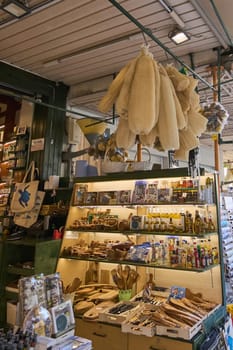 Crete, Greece - April 5, 2025: Charming souvenir shop featuring natural sponges, rustic kitchen tools, and local spices, creating an inviting and authentic market atmosphere.