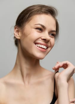 Cheerful female posing with a beaming smile and sparkling eyes, exuding confidence and warmth. Ideal for beauty, wellness, and lifestyle themes.