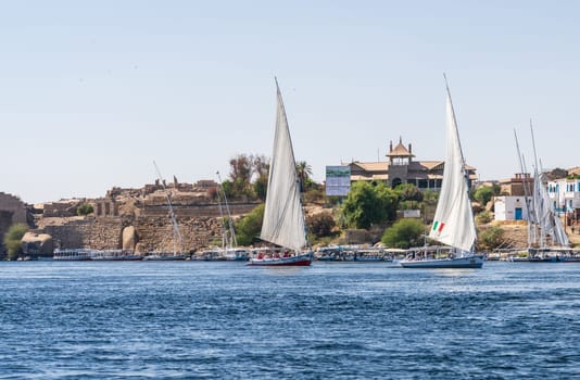Aswan, Egypt - 4 November 2024: Aswan Museum in Elephantine, by the Nile. Felluca sail by the ruins of Abu