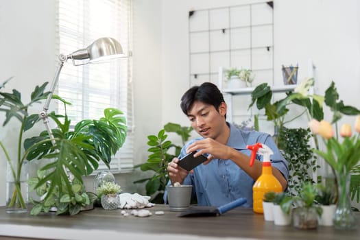 A gardening enthusiast captures the beauty of indoor plants, blending the joy of gardening with photography in an eco-friendly living space.